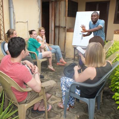Volunteers receive a language lesson as an add on to their project